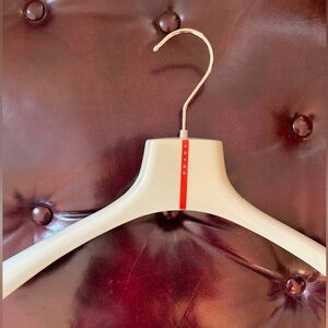 Prada Grey Hanger with Red Logo Stripe designer.